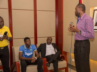 Sir Curtly Ambrose (right) has the attention of Leon Rodney (left), Alzarri Joseph and Sports Minister EP Chet Greene. 