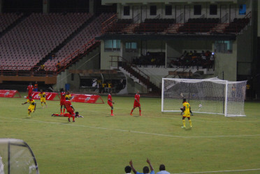 Gregory Richardson (left) racing off to celebrate after breaking the deadlock in the 19th minute against Suriname at the National Stadium in Providence during their International Friendly. (Orlando Charles photo) 