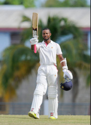 Shai Hope celebrates reaching three figures yesterday against the Guyana Jaguars. 
