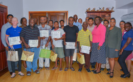 Six graduates of the Sterling Products Ltd Literary Programme with others at the graduation (SPL photo)