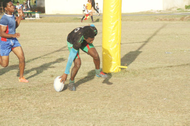 Captain Lance Adonis records a try for the UG Wolves in their 99-nil drubbing of the Police Falcons Saturday when the GRFU/GTT 15s league continued at the National Park. 