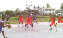 Action between Ithaca Hard-Liners in purple and New Amsterdam Warriors in orange during their matchup in the BABA sanctioned Anamayah Memorial Basketball Championship at the Ithaca Basketball Court.
 
