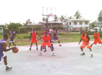 Action between Ithaca Hard-Liners in purple and New Amsterdam Warriors in orange during their matchup in the BABA sanctioned Anamayah Memorial Basketball Championship at the Ithaca Basketball Court.
 
