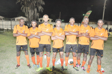 Slingerz FC goal scorers from left to right: Devon Millington, Trayon Bobb, Julian Wade, Vurlon Mills, Domini Garnett, Tichard Joseph and Clive Nobrega pose following their 7-1 win over Guyana Defence Force.