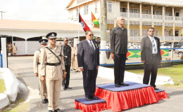 President David Granger (second from right)), Prime Minister Moses Nagamootoo (second from left), Minister of Public Security, Khemraj Ramjattan (right) and Commissioner of Police,  Seelall Persaud  (left) taking the salute from the officers of the Guyana Police Force. (Ministry of the Presidency photo)
