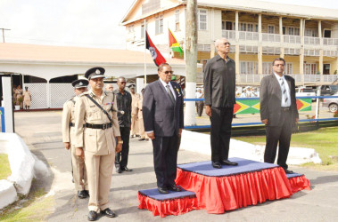 President David Granger (second from right)), Prime Minister Moses Nagamootoo (second from left), Minister of Public Security, Khemraj Ramjattan (right) and Commissioner of Police, Seelall Persaud (left) taking the salute from the officers of the Guyana Police Force. (Ministry of the Presidency photo)