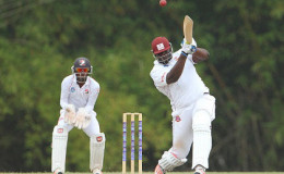 Rahkeem Cornwall goes on the attack during his top score of 65 for Hurricanes against Red Force yesterday. (Photo courtesy WICB Media) 