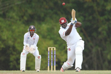Rahkeem Cornwall goes on the attack during his top score of 65 for Hurricanes against Red Force yesterday. (Photo courtesy WICB Media) 