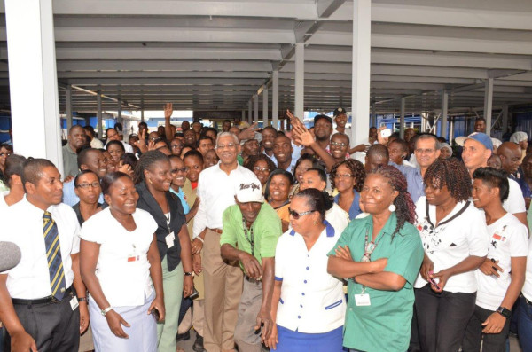 President David Granger with staff of Banks DIH (Ministry of the Presidency photo)