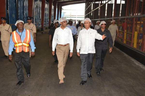 President David Granger (centre) being given a tour of Banks DIH's Thirst Park factory by Chairman of the Board of Directors and Managing Director,  Clifford Reis (right). (Ministry of the Presidency photo)