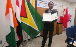Darrell Fraser posing with his certificate (MARAD photo)