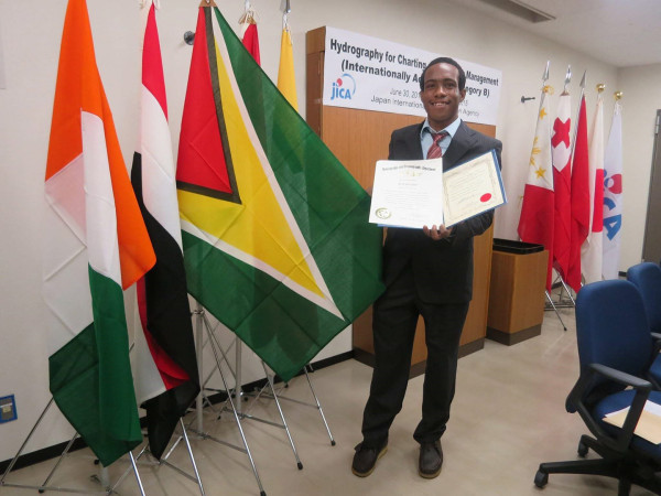 Darrell Fraser posing with his certificate (MARAD photo)