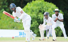 Captain Kraigg Brathwaite plays through the on-side during his unbeaten 105 on the opening day of the ninth round game at the National Cricket Centre yesterday. (Photo courtesy WICB)