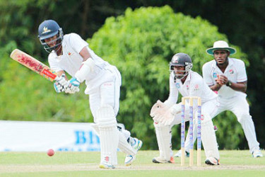 Captain Kraigg Brathwaite plays through the on-side during his unbeaten 105 on the opening day of the ninth round game at the National Cricket Centre yesterday. (Photo courtesy WICB)