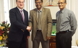 From left in this Ministry of Public Security photo are Russian Ambassador to Guyana Nikolay Smirnov,  Minister of Public Security  Khemraj Ramjattan and  Coordinator of the Task Force on Narcotic Drugs and Illicit Weapons, Major General (Retired) Michael Atherly.