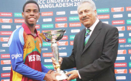 FLASHBACK! West Indies U19 skipper Shimron Hetmeyer of Guyana receives the World Cup trophy. (Photo courtesy of WICB media)