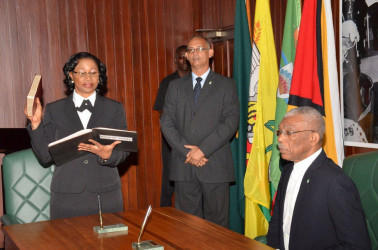 Justice Yonette Cummings-Edwards, Chief Justice (Ag) takes her Oath as a Member of the Judicial Service Commission, before President David Granger.  (Ministry of the Presidency photo) 