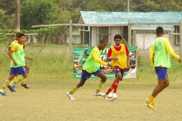 FLASHBACK! Scenes from the earlier group stage of the fourth annual Milo Secondary Schools  U20 football championships at the Ministry of Education ground, Carifesta Avenue. 