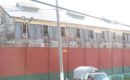 Inmates had kicked out the wooden walls of this building in the Georgetown Prison compound during last week’s riot. The prison administration has replaced the walls with metal plates. (Photo by Keno George)
