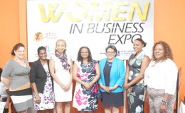 Minister of Social Protection Volda Lawrence (centre) posing with Sonia Noel (third left), Permanent Secretary of the Ministry of Business Rajdai Jagarnauth (second left), Beverly Harper, (third right) and others after the official launching of Women in Business
