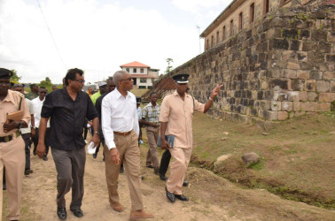 President David Granger (third from left) and Minister of Public Security,  Khemraj Ramjattan (second from left) being led on a tour of the Mazaruni Penal Settlement by Officer in Charge, Alexander Hopkinson yesterday. The visit was part of an assessment of the options for the prison system in the wake of Thursday’s deadly riot at the Camp Street jail. (See story on page three) (Ministry of the Presidency photo) 