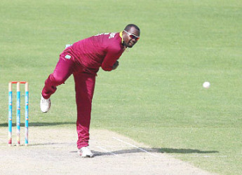 Off-spinner Ashley Nurse sends down a delivery during his spell against Warwickshire on Sunday. (Photo courtesy WICB Media)  