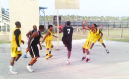 Action between Fyrish Black Sharks in black and Rose Hall Town Jammers in yellow during their matchup in the BABA sanctioned Anamayah Memorial Basketball Championship at the Ithaca Basketball Court Sunday.
