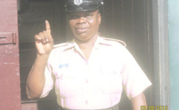 A policewoman showing her inked finger after voting at the New Amsterdam Town Hall yesterday.
