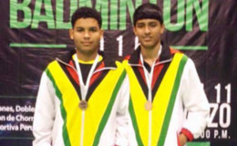 The two players Mangra, left, and Ramdhani show off their bronze medals.