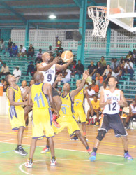 Ryan Stephney of Ravens goes airborne amidst heavy traffic to score two of his 15 points, 14 of which came in the final quarter. (Orlando Charles photo) 