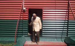 Chairman of the Commission of Inquiry Justice James Patterson exits the Camp Street prison after a Commission visit to the facility. (Photo by Keno George)
