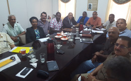 Natural Resources Minister Raphael Trotman (sixth from left) meeting with the miners (GGDMA photo)