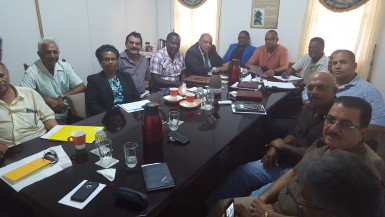 Natural Resources Minister Raphael Trotman (sixth from left) meeting with the miners (GGDMA photo) 