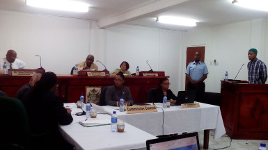 Michael Lewis, the fourth prisoner to testify at the CoI into the prison unrest, at the witness stand. Seated at rear (from left) are: Commissioner Dale Erskine, Chairman of the Commission of Inquiry Justice James Patterson and Commissioner Merle Mendonca. From left (at front) are: Representative of the Guyana Prison Service and the Guyana Police Force Selwyn Pieters; President of the Bar Association Christopher Ram; Commission Counsel Excellence Dazzell; and Commission Secretary Teshanna Cox. (Photo by Keno George) 