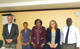 Minister within the Ministry of Public Infrastructure, Annette Ferguson (centre) with (left to right) Arran De Moubray, Technical Project Coordinator, CARIBSAVE; Judi Clarke, Caribbean Regional Director, CARIBSAVE; Sophie Makonnen, IDB Representative; and Horace Williams, CEO of the Hinterland Electrification Company Inc. (MPI photo)
