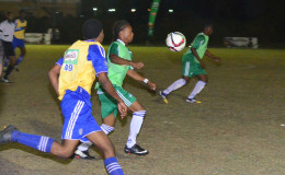 Job Caesar (centre) of Chase Academy trying to control the ball while being challenged by a South Ruimveldt player during their semi-final affair in the 4th Annual Milo Schools u-20 Football Championship.
