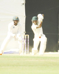 Jermaine Blackwood plays a booming drive during his half-century yesterday. 