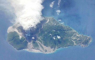 A view of the Caribbean island of Montserrat, with the Soufriere Hills volcano erupting, viewed from orbit aboard the International Space Station on October 11, 2009. 