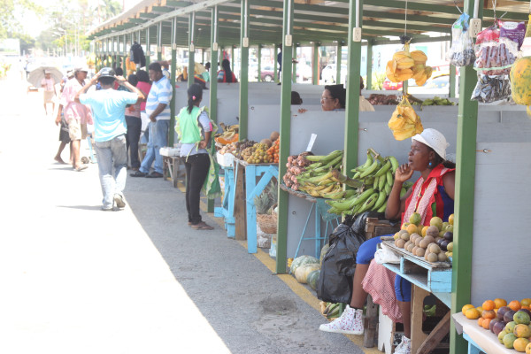 Vendors plying their trade from their new stalls at Merriman Mall, which they have complained are small and overpriced. (See story on centre pages) (Photo by Keno George) 