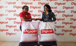 Executive member of the GHDS Ananda Latchman (right) and Communications Manager of Digicel Vidya Sanichara.
