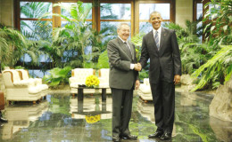 President Barack Obama and Cuba’s President Raul Castro shake hands during their first meeting on the second day of Obama’s visit to Cuba, in Havana. (Reuters/Jonathan Ernst)