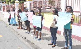 Part of the protest against a decision made by Magistrate Dylon Bess to bar a cross-dressing litigant from his court. (Photo by Keno George)
