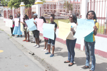 Part of the protest against a decision made by Magistrate Dylon Bess to bar a cross-dressing litigant from his court. (Photo by Keno George) 