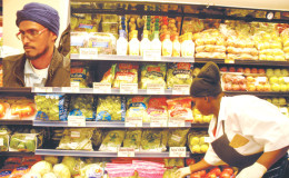 Fresh vegetables in new supermarket  Inset: General Manager Jaipersaud Guyapersad
