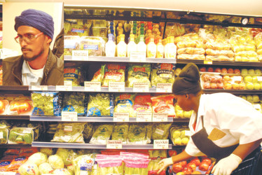 Fresh vegetables in new supermarket  Inset: General Manager Jaipersaud Guyapersad 