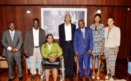 President David Granger (fourth from right) with Winslow Carrington’s family (Ministry of the Presidency photo)
