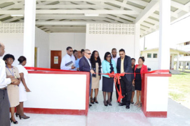 National Tuberculosis Programme Manager, Dr. Jeetendra Mohanlall along with the Minister within the Ministry of Public Health Dr. Karen Cummings cutting the ribbon to commission the Chest Clinic (GINA photo)