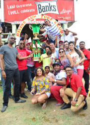 Handlers of King’s Night joyfully collecting the spoils of the C and Lower event of the Guyana Cup Fever yesterday. (Orlando Charles photo)