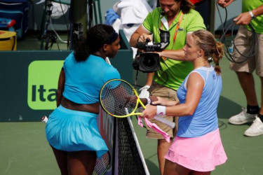 Svetlana Kuznetsova (R) shakes hands with Serena Williams (L) after their match on day seven of the Miami Open at Crandon Park Tennis Center. Kuznetsova won 6-7(3), 6-1, 6-2. Mandatory Credit: Geoff Burke-USA TODAY Sports.