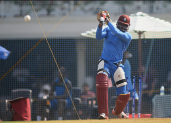THE PLOT THICKENS! Opener Chris Gayle bats during a net session ahead of today’s semi-final of the T20 World Cup against India. (Photo courtesy WICB Media) 